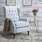 Fauteuil club capitonné en velours