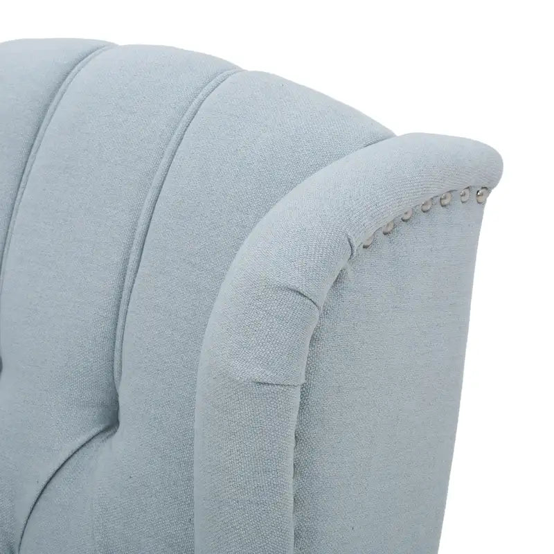 Fauteuil club capitonné en velours