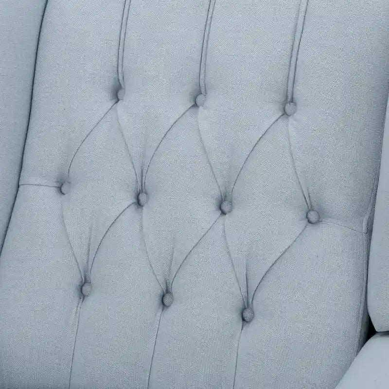 Fauteuil club capitonné en velours