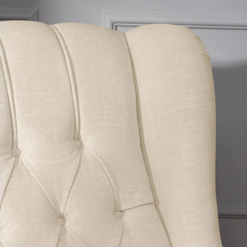 Fauteuil club capitonné en velours